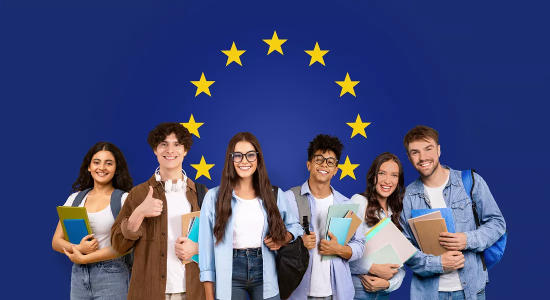 joyful-multiethnic-group-five-college-students-with-books-backpacks-standing